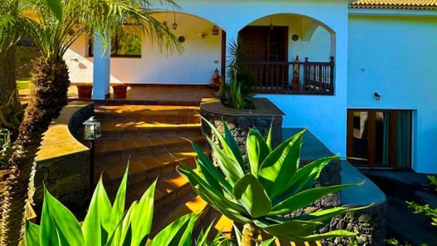 A two-story house with a tiled roof, a balcony, and a small pool area. - Villa in La Orotava 7 Bedrooms 1 bed 7 Baths (La Orotava)