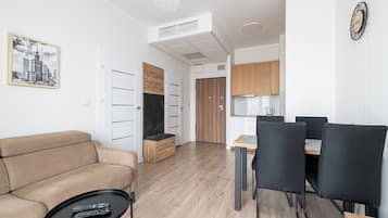 Comfort Apartment | Living area | 37-inch flat-screen TV with digital channels