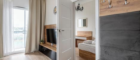 Comfort Apartment | Living area | 37-inch flat-screen TV with digital channels