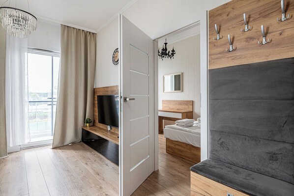 Apartamento Confort | Zona de estar | Televisión de pantalla plana de 37 pulgadas con canales digitales