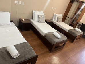 Triple Room, 3 Single Beds | Minibar, desk, laptop workspace, soundproofing