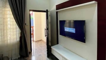 Elite Apartment | Living area | 32-inch Smart TV with cable channels