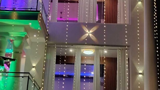 A multi-story building with a sign reading 'SAMI RESORT.' - Sami Resort  (Tirupattur)