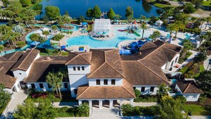 A resort with multiple swimming pools, a water park, and a large building with a tiled roof. - Fabulous Townhouse Near to Disney (Kissimmee)