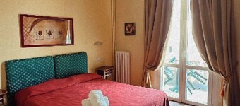 Room in Guest Room - Fly in Viareggio Beach in Front of the Famous Promenade With Shops and Establishments