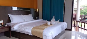 Relax in this inviting room with a comfortable bed, nightstand, and stunning view.