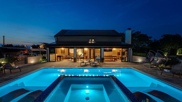 A modern house with a swimming pool, outdoor seating, and a well-lit patio area. - Luxury Villa Meden Dol with heated pool, Hot-Tub, 2 Saunas (Skradin)