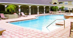 Outdoor pool, pool umbrellas, pool loungers - Stylish Condo Near Clearwater's Beach (Clearwater)