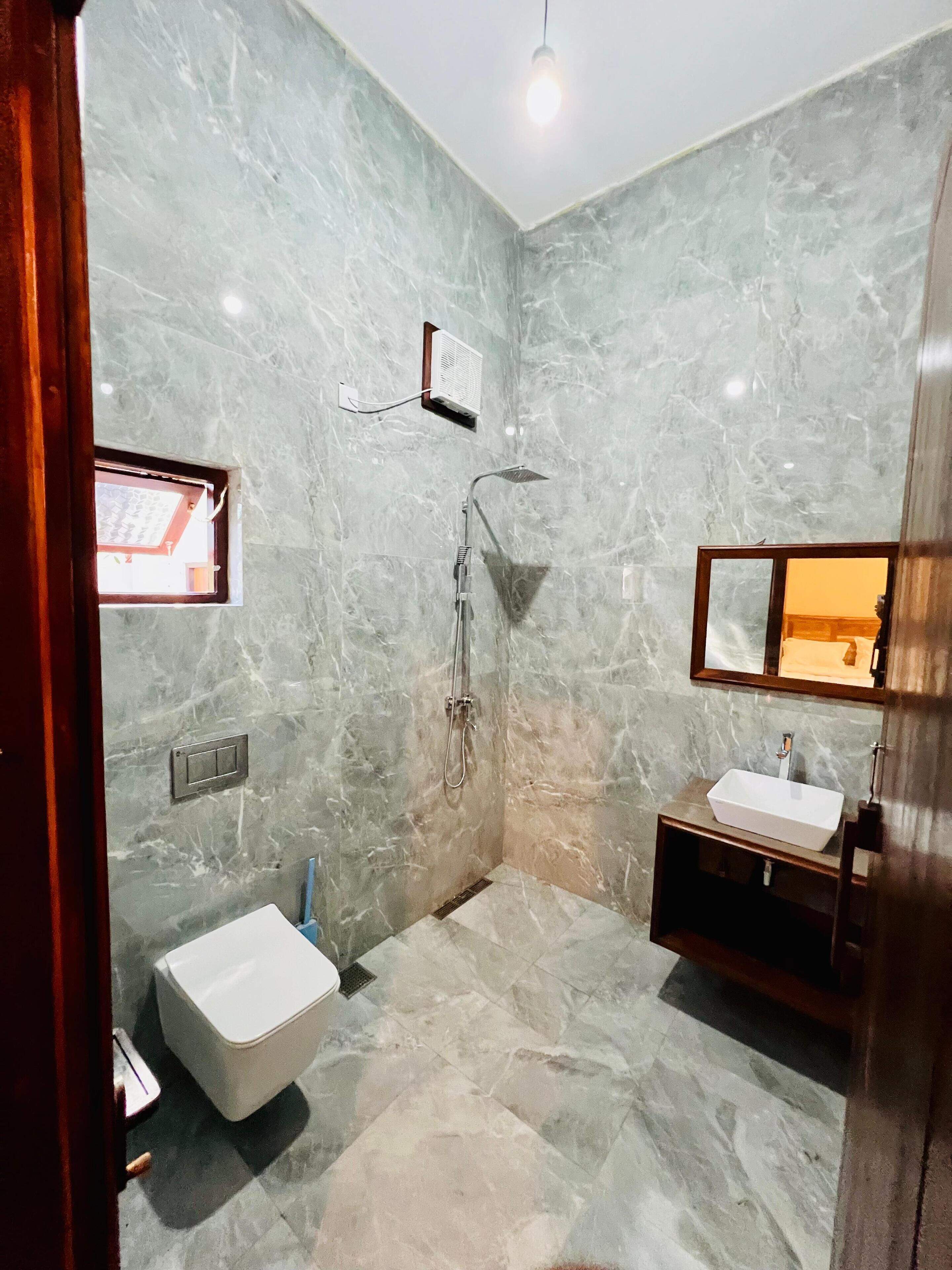 Shower, rainfall showerhead, towels, soap