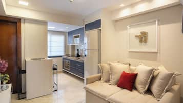 Standard Apartment, 1 Bedroom | Living area | 50-inch Smart TV with digital channels