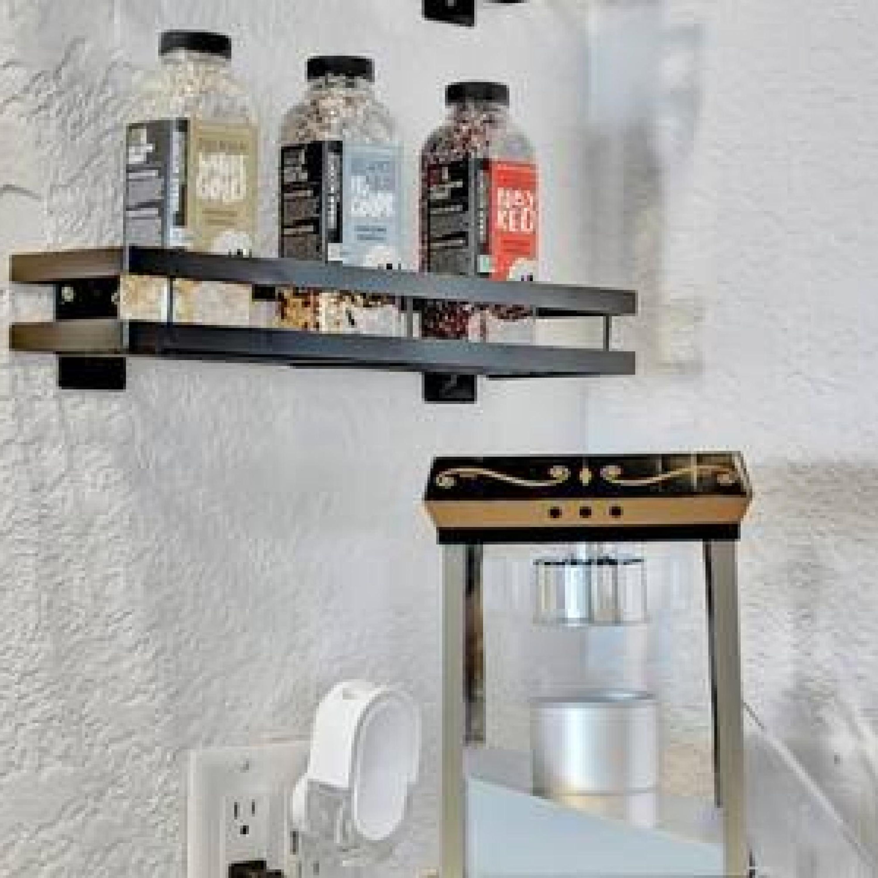 A kitchen counter with a coffee machine, a jar of sugar, and a jar of salt.