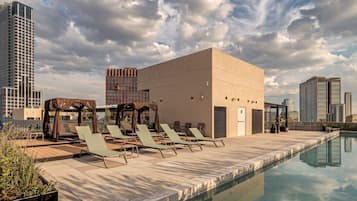 Outdoor pool, open 6:00 AM to 10:00 PM, pool umbrellas, pool loungers