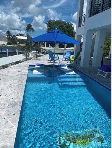 Gorgeous new build on Cudjoe Marina Basin with 80 ft boat dock and private pool