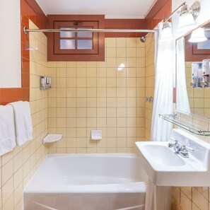 A bathroom with a bathtub, a shower, a sink, and a mirror. - The Lodge at Bryce Canyon (Bryce Canyon)