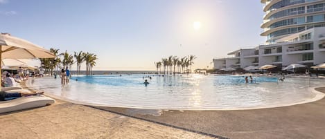 Outdoor pool, pool umbrellas, pool loungers