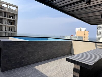 Modern Getaway with Rooftop Pool & Stunning Ocean Views