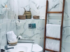 Shower, hair dryer, towels, soap