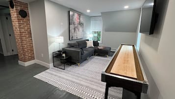 Smart TV, fireplace, books, computer monitors