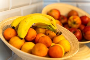 A bowl of fruits including bananas, oranges, and apples. - Sleep Port (Gdańsk)