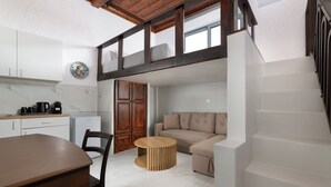 A compact living space with a kitchen, dining area, and a sofa. - Casa Traditionale (Rhodes)