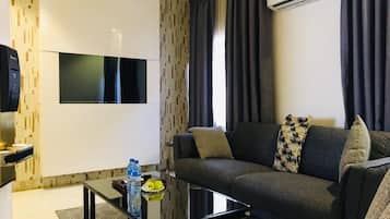 Premier Suite, Non Smoking, Private Bathroom | Living area | 43-inch Smart TV with cable channels