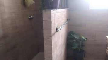 Shower, hair dryer, towels, shampoo