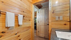 A wooden interior with a towel rack, a door, and a countertop. - Serene Retreat, Private Setting, Near Muir Valley Climbing & Redpoint BBQ (Rogers)