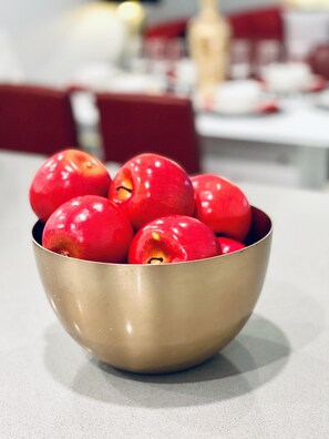 A bowl of red apples on a table. - Brand New Condo at Champion Gate With Golf View, Near Famous Attractions (Kissimmee)
