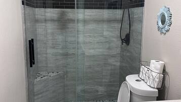 Shower, hair dryer, towels, soap