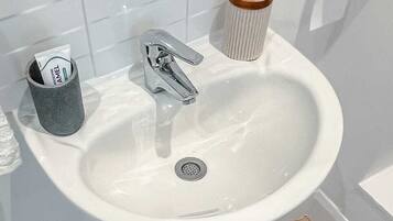 Hair dryer, towels, soap, toilet paper