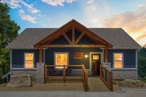A lodge with a wooden facade, stone accents, and a sign reading "HIGH TIDE." - New Home in Trophy Run with Private Hot Tub & Firepit, Near Taneycomo & Table Rock, Free Tickets (Branson)