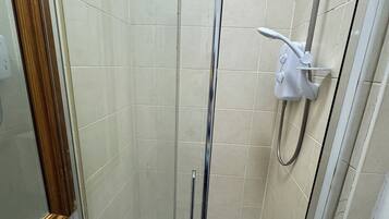 Hair dryer, towels, shampoo, toilet paper