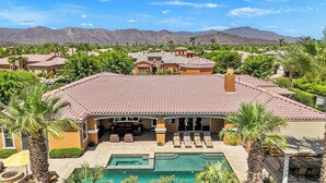A residential property with a swimming pool, multiple rooms, and a view of mountains. - Villa Paradiso - 2 Pools, 5 Suites & More! (Indio)