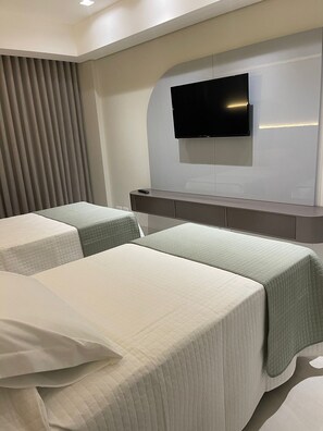 Quarto família, cozinha, vista para a cidade | Wi-Fi de cortesia, roupa de cama