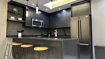 Fridge, microwave, stovetop, coffee/tea maker