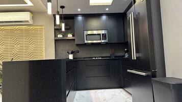 Fridge, microwave, stovetop, coffee/tea maker