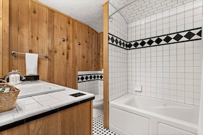 Jetted bath, hair dryer, towels, shampoo