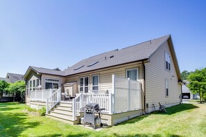 A single-story house with a front porch, a covered patio, and a small attached garage. - Deck, Hot Tub & Resort Amenities: Ocean View Gem (Ocean View)