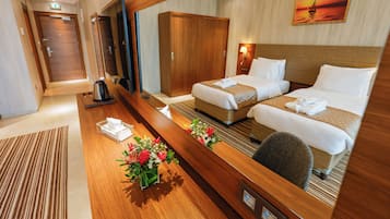 Twin Room | Minibar, in-room safe, laptop workspace, iron/ironing board