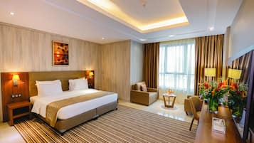 Superior King Room | Minibar, in-room safe, laptop workspace, iron/ironing board