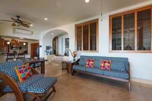 A spacious living area with a sofa, chairs, and a dining table. - Best Views of Zihua 3Bed 3 Bath luxury (Zihuatanejo)