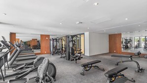 A gym with treadmills, weight machines, and benches. - Zantamar 307B: Beachfront Suites w Ocean Views (Cruz de Huanacaxtle)