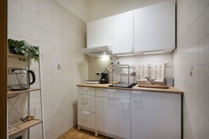 Fridge, microwave, stovetop, coffee/tea maker