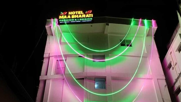 A hotel with a sign reading "HOTEL MAA BHARATI" and neon lights on the facade. - Hotel Maa Bharati  (Guwahati)