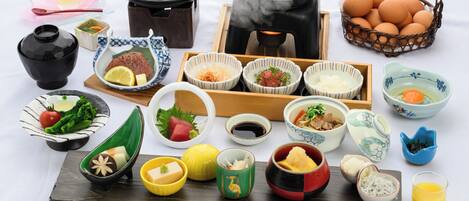 A variety of Japanese dishes and utensils arranged on a table.
