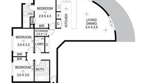 A floor plan with three bedrooms, a kitchen, a living/dining area, and a bathroom.