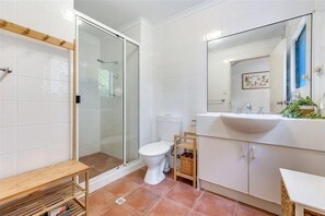 Shower, towels, soap, toilet paper
