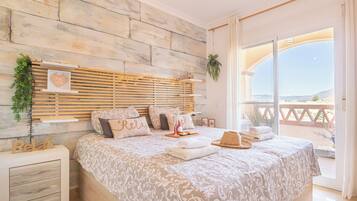 Family Apartment, Multiple Bedrooms, 2 Bathrooms (Luxury Mijas Golf, Pool & Pet Retreat) | 2 bedrooms, laptop workspace, iron/ironing board, free WiFi