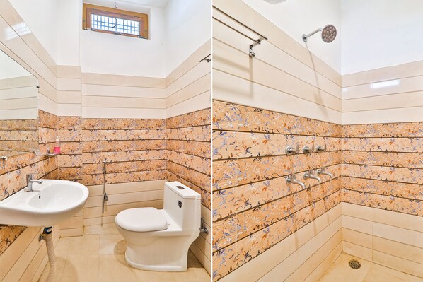 A bathroom with a sink, toilet, and shower.