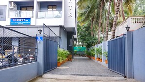 A gated entrance to a hotel with a sign for 'Samrat Inn' and a 'No Parking' sign. - Fabhotel Everest Inn (Pune)